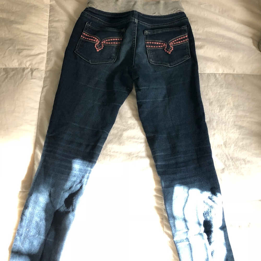 Slightly distressed kids jeans.